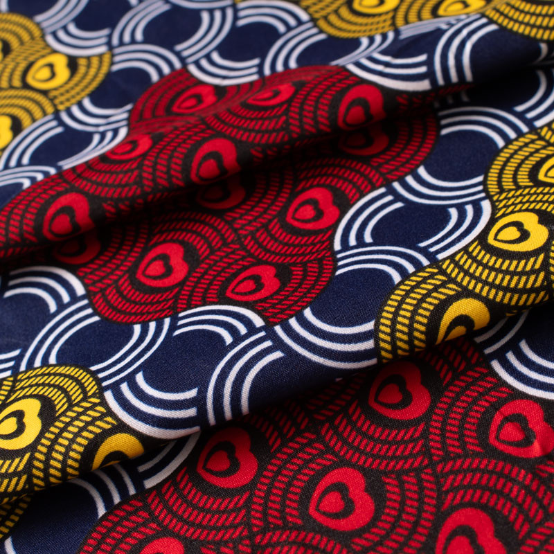 Tissu-esprit-wax-géométrique-bleu-rouge-et-jaune