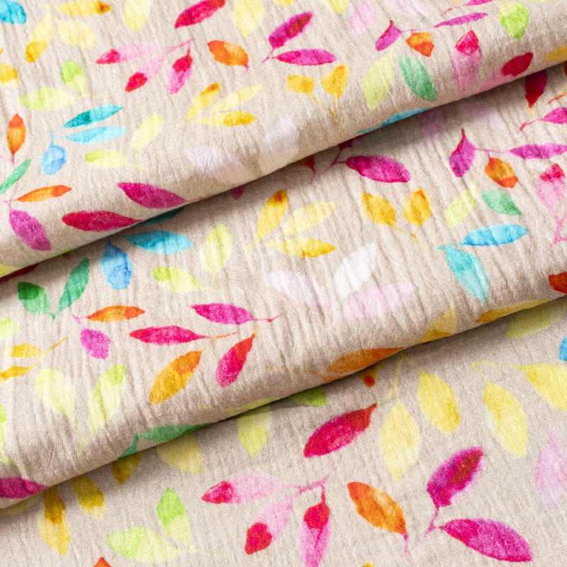 Tissu-double-gaze-imprimé-feuillage-multicolore-sur-fond-greige