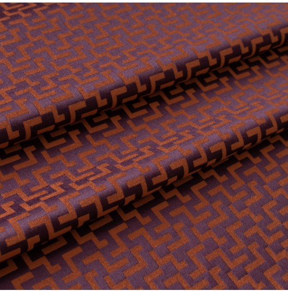 Jacquard-stof-met-geometrisch-motief-oranje-en-aubergine