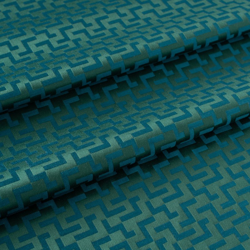 Jacquard-stof-met-geometrisch-motief-groen-en-blauw